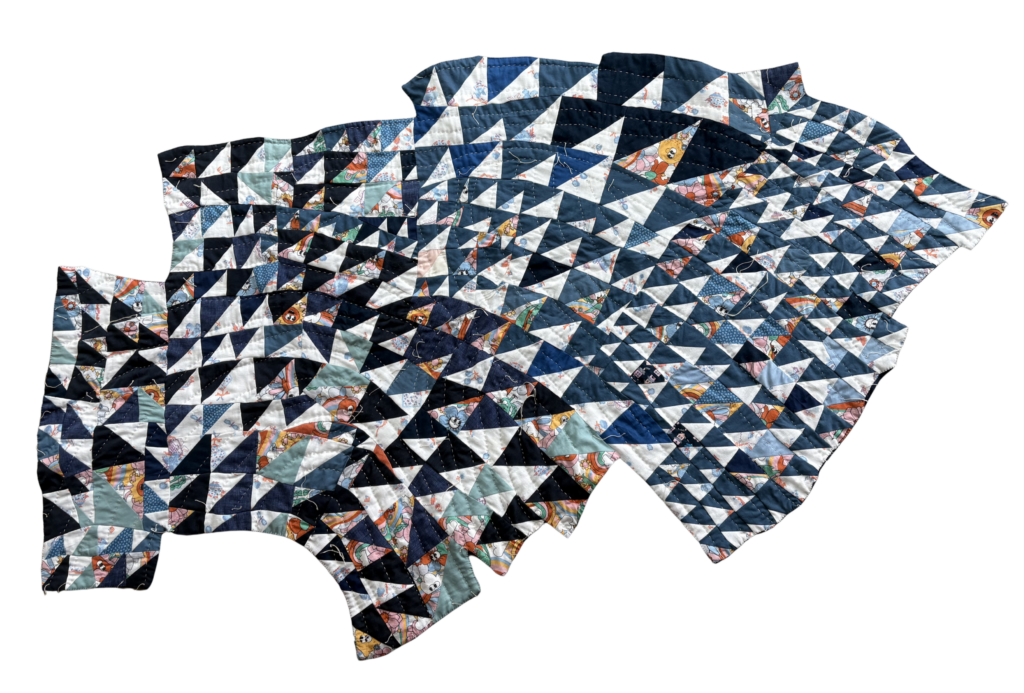 organically shaped quilt of different-sized triangles.